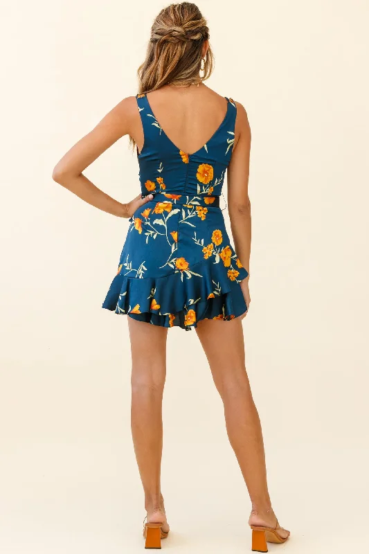 Wishful Thinking Plunging Neckline Ruffle Hem Romper Floral Print Navy